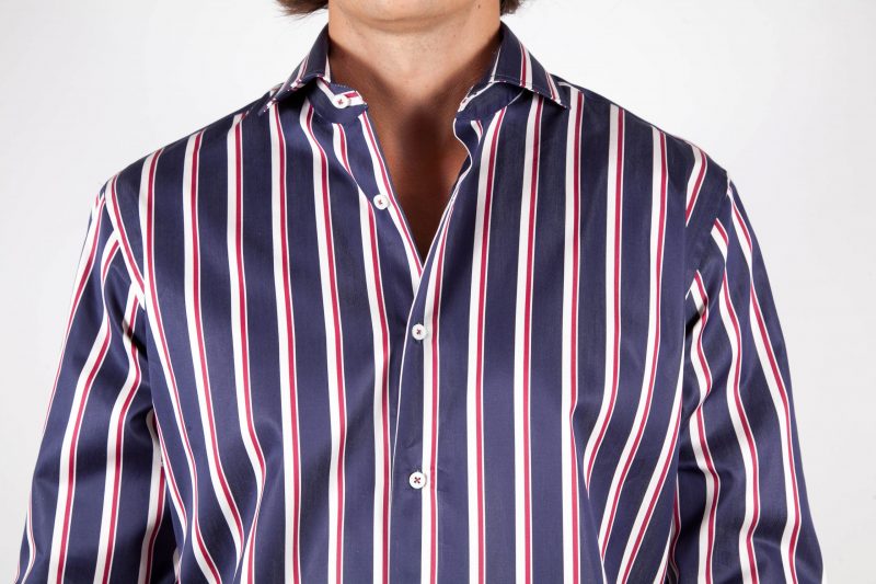 Shirt with blue and white lines.
